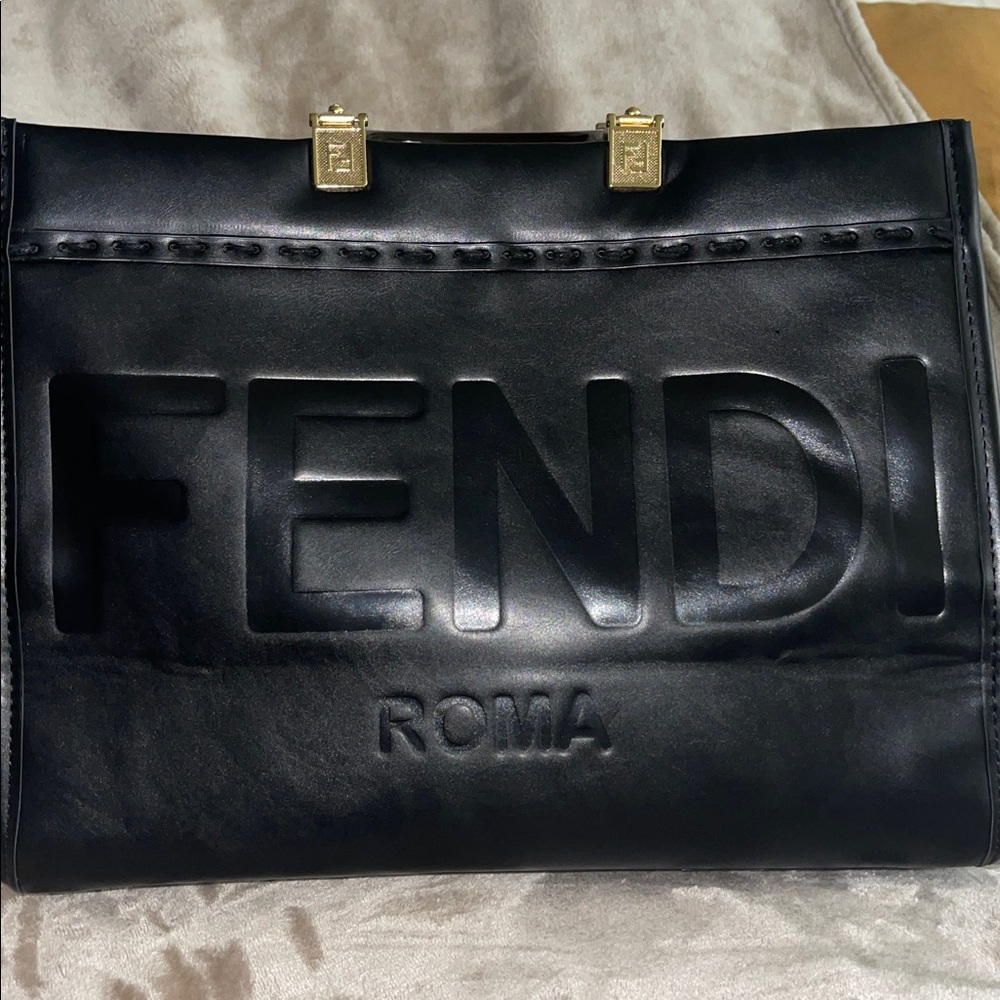 Black tote with wide strap 
See pictures for all details